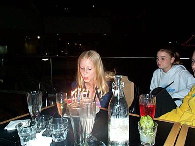 Amy blowing out candles